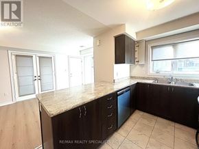 Brampton (Northwest Brampton) townhouse for rent - A kitchen with a counter top and cabinets.