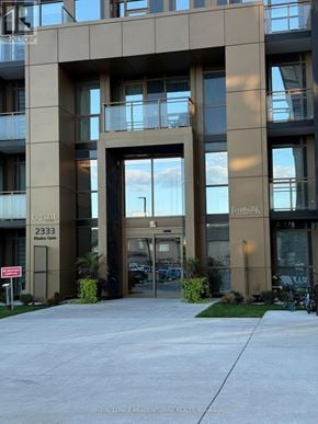 Oakville (Wm Westmount) condo for rent - The image shows the front of a building with the name "Crystal" and the number 2333 on it.