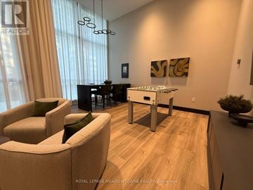 Oakville (Wm Westmount) condo for rent - A living room with a dining table and chairs.