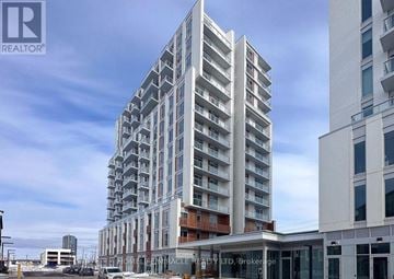 Brampton (Northwest Brampton) condo for rent - A tall residential building with many windows and balconies is under construction.