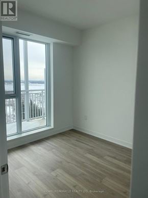 Brampton (Northwest Brampton) condo for rent - A room with a view of the outside through a large window.