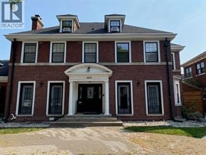 Windsor apartment for rent - A brick house with a black door and windows.