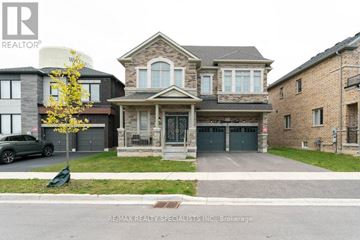 Hamilton (Waterdown) apartment for rent - A house with a tree in front of it is for sale.