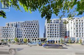 Toronto (Clanton Park) condo for rent - A city street with cars and buildings in the background.