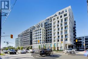 Toronto (Clanton Park) condo for rent - A large building with many windows is in the background of a busy street.