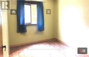 Toronto (Westminster-Branson) apartment for rent - A room with a window and a picture on the wall.