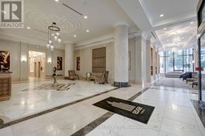 Mississauga (Fairview) condo for rent - A large, well-lit lobby with marble floors and a reception desk.