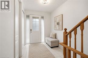 Niagara-On-The-Lake townhouse for rent - A hallway with a bench and a door.