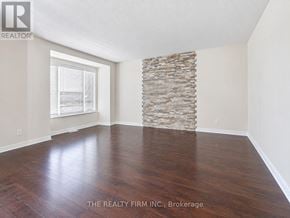 London South (South W) townhouse for rent - A room with wooden floors and a stone wall.