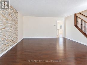 London South (South W) townhouse for rent - A room with wooden floors and a stone wall.