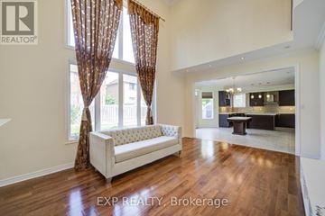 Markham (Wismer) apartment for rent - A living room with a white sofa and wooden floors.