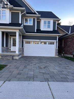 Hamilton (Meadowlands) apartment for rent - A two-story house with a white garage door.