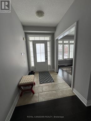 Hamilton (Meadowlands) apartment for rent - A hallway with a bench and a door.