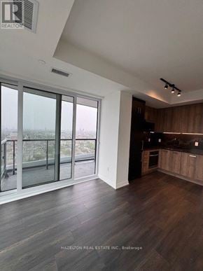 Toronto (Kensington-Chinatown) condo for rent - A real estate brokerage office with wood flooring and a large window.