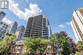 Toronto (Mount Pleasant West) condo for rent - A cityscape with a mix of modern and traditional architecture under a clear sky.