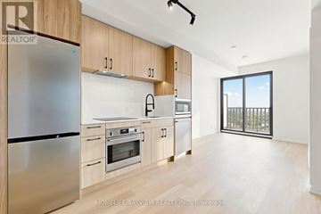 Toronto (Mount Pleasant West) condo for rent - A kitchen with wooden cabinets and stainless steel appliances.