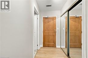 Hamilton apartment for rent - A hallway with two doors and a REALTOR® logo.