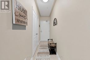 Bradford West Gwillimbury (Bradford) condo for rent - A hallway with a sign that says "Home Sweet Apartment" on the wall.