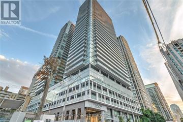 Toronto (Mount Pleasant West) condo for rent - A tall building with the words "HOMELESS NEW WORLD REALTY INC." on the front.