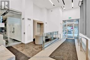 Toronto (Mount Pleasant West) condo for rent - A real estate office with a glass wall and a carpeted floor.