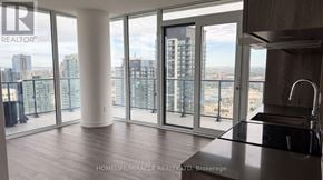 Mississauga (City Centre) condo for rent - A spacious kitchen with a view of the cityscape.