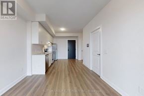 Oakville (Jm Joshua Meadows) condo for rent - A hallway with wood flooring and white walls.