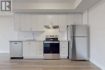 Oakville (Jm Joshua Meadows) condo for rent - A modern kitchen with white cabinets and stainless steel appliances.