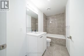 Toronto (Moss Park) condo for rent - A bathroom with a white sink and toilet.