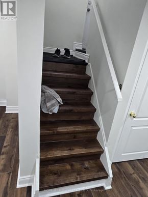 Brampton (Sandringham-Wellington) apartment for rent - A set of stairs with a white railing and wooden steps.