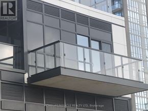 Mississauga (Hurontario) condo for rent - A modern building with a balcony and a sign that reads "REALTOR".
