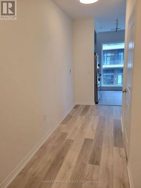 Mississauga (Hurontario) condo for rent - A room with wooden flooring and white walls.