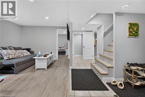 Kitchener apartment for rent - A living room with a grey couch and a white coffee table.