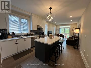 Hamilton (Eleanor) apartment for rent - A well-lit kitchen with a large island in the middle.