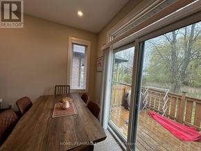 Hamilton (Eleanor) apartment for rent - A dining room with a wooden table and chairs.