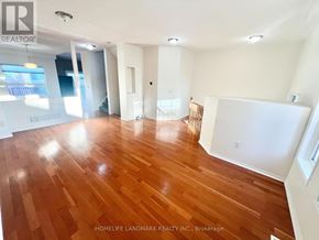 Markham (Berczy) apartment for rent - A room with wooden flooring and white walls.