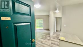 Waterloo multi-family for rent - A green door with a sign that says REALTOR on it.