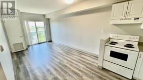 Kitchener multi-family for rent - A kitchen with a white stove and cabinets.
