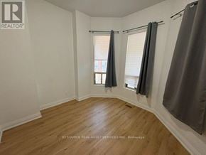 Toronto (Kensington-Chinatown) apartment for rent - A room with a window and a wooden floor.