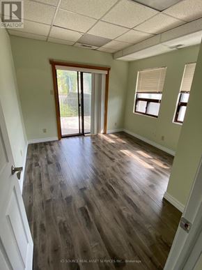 Toronto (Annex) apartment for rent - A room with a sliding glass door and wood flooring.