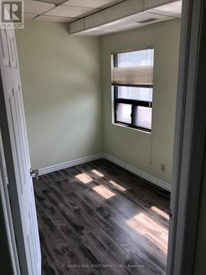 Toronto (Annex) apartment for rent - A room with a window and a wooden floor.