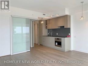 Toronto (Mount Pleasant West) condo for rent - A modern kitchen with wooden cabinets and a glass door.