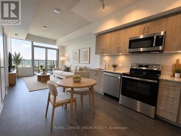 Toronto (Humber Heights) condo for rent - A modern kitchen with a dining table and chairs.