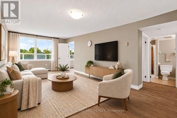 London North (North G) condo for rent - A living room with a couch, chair, and television.