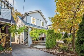 Toronto (East End-Danforth) apartment for rent - A house with a sign that says Chestnut Park Realty.