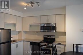 Toronto (Henry Farm) condo for rent - A kitchen with a refrigerator, microwave, oven, and sink.