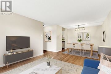 London South (South X) condo for rent - A living room with a grey sofa and a television.