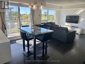 Toronto (Bathurst Manor) condo for rent - A modern dining room with a glass table and chairs.