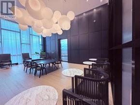 Oakville (Jm Joshua Meadows) condo for rent - A modern dining room with a long table and chairs.