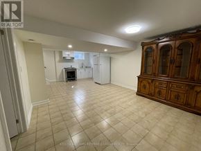Toronto (Maple Leaf) apartment for rent - A spacious room with a kitchen area in the background.