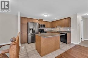 Smithville apartment for rent - A kitchen with wooden cabinets and a large island.